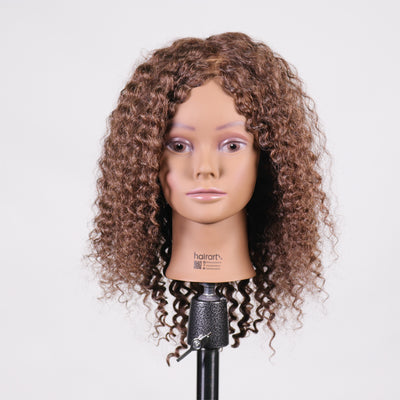 A mannequin head with tight curl hair, featuring a brown tone and positioned on a stand.
